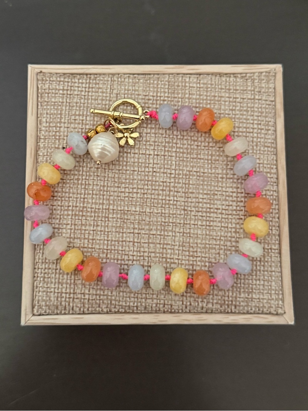 Hand Knotted Colorful Beaded Bracelet with Gold Toggle and Shell Charm